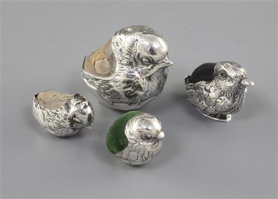 An early 20th century novelty silver pin cushion, modelled as a hatching chick by Sampson Mordan & Co & 3 others.
